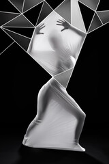 When trapped by your reality let your imagination free you. Studio shot of a woman wrapped in fabric and surrounded by geometric shapes against a black background.