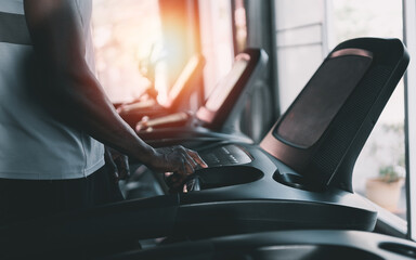 African sport man running on treadmill in fitness club. Cardio workout. Healthy lifestyle, guy...