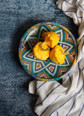 Patty pan squash on decorative ceramic plate. Sill life with vegetables. Beautiful yellow patty pan...