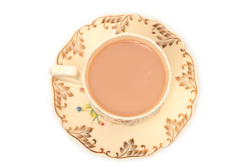 Tea with milk in a porcelain cup