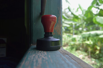 Manual stamp flash photo shot in window. close up photo. there is only low light.