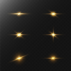 A set of flares, bright lights and sparkles on a black background. Golden flashes and glare. Abstract golden isolated lights Bright rays of light. Glowing lines.