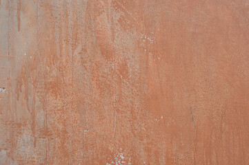 Dripping wall paint forms beautiful art. white wall with orange paint drops.