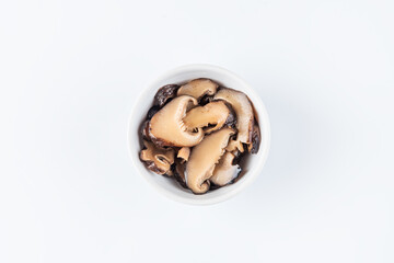 Pickled mushrooms in a bowl. View from above. Flat lay