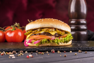 Burger with beef, cheese, red onion and pickled cucumber