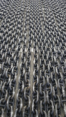 Rusty ship anchor chain in harbour