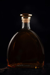 Brandy bottle on a dark background