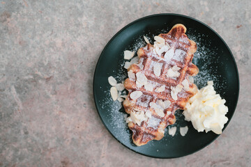 sweet waffle dessert on cafe table at garden home, breakfast meal food made from fresh delicious croissant and sugar baked cooking