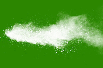 Explosion of white powder isolated on green background. Abstract colored background. holi festival.