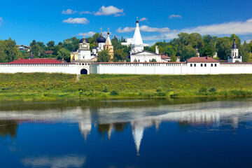 Fototapeta na wymiar Volga river and view of Holy Dormition Monastery in Staritsa. Tver Oblast, Russia