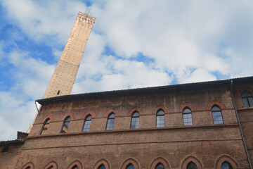 Piazza Maggiore with its sumptuous palaces, the orange-colored houses and the marbles of the Basilica of San Petronio