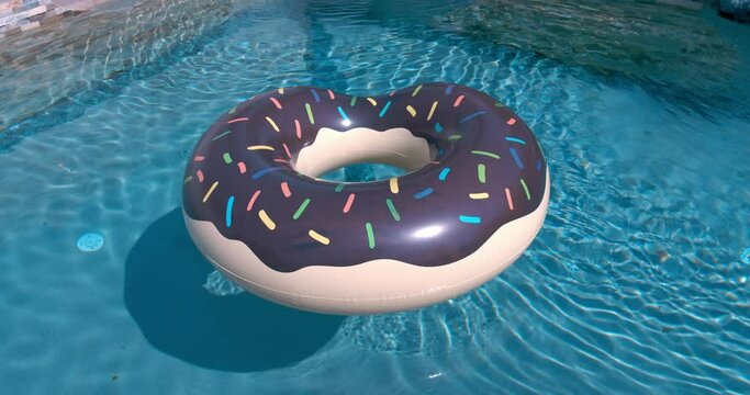 Inflatable Donut Floating In The Swimming Pool