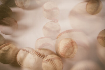 Old used baseball balls with double exposure abstract sports concept.