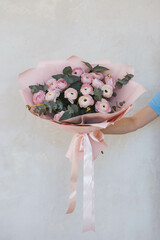 pink flowers, a bouquet of ranunculus on a bright background