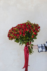 roses, bush roses, a large bouquet of red roses on a bright background