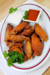 Spicy Deep Fried Buffalo Wings Served with Hot Sauce and Blue Cheese Dressing