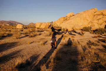 Photographer taking picture in desert shadow