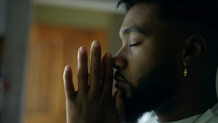 A spiritual African man worshiping God praying with HOPE and FAITH