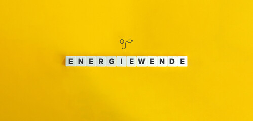 Energiewende (Energy transition in German) Word and Icon. Letter Tiles on Yellow Background....