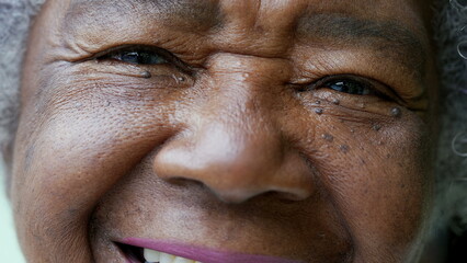 A happy senior African woman macro closeup face smiling