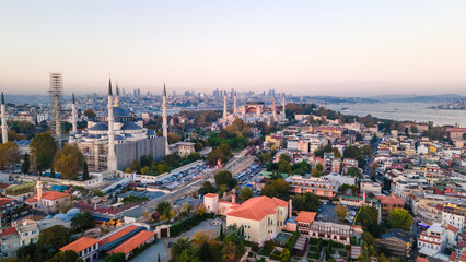 Obraz premium Aerial view of Blue Mosque with six minarets in Istanbul, Turkey. Top view of tourist famous place Sultanahmet Camii in the old city center on sunrise