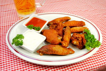 Picnic Plate of Spicy Fried Buffalo Wings Served with Hot Sauce and Blue Cheese Dressing