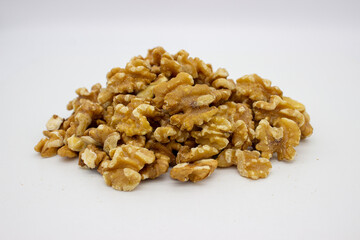 Peeled walnuts on white background