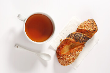 Tea and bun with seeds