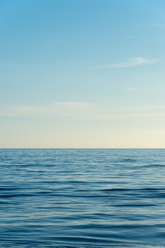 clear sky and calm sea or ocean water surface background