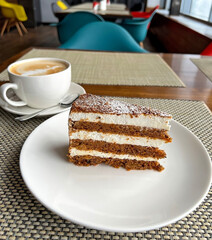 Cappuccino coffee and cake with cream 