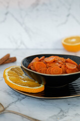 Carrot Tzimmes stew with sweet orange juice in a bowl. Typical Jewish dish food.