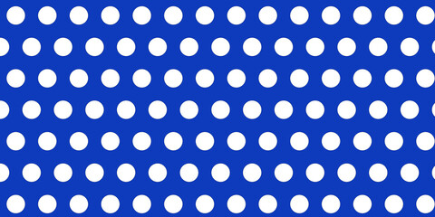 white polka dot on blue background © Rauno