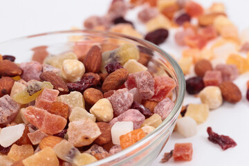 Dried fruits and nuts in a glass bowl.