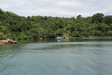 Beautiful views of a boat in the sea of Paraty, Rio do Janeiro, Brazil.