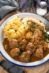 Minced meat balls in mushroom sauce.