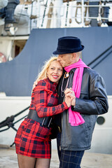 Obraz premium Romantic middle-aged couple embracing the port