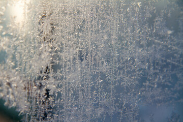 Frost patterns on glass in a close up
