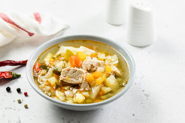 Pork vegetable stew in plates. Top view, copy space, flat lay.