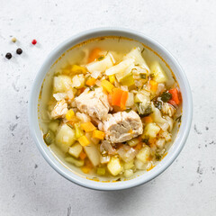 Comfort foos, slow cooker pork vegetable soup. Top view, copy space, flat lay.