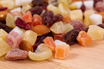 Healthy dried fruits on wood table as background.