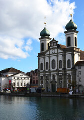 Fototapeta na wymiar Jesuit Church along the river Reuss in Lucerne's old town