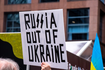 View of sign Russia Out of Ukraine during the rally against invasion of Ukraine in front of Vancouver Art Gallery