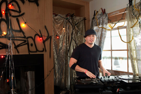 DJ with turntable at party