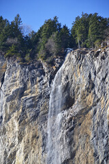 Staubbach waterfall during winter time in Lauterbrunnen village, Switzerland
