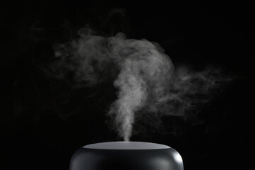 The concept of humidification of the air. Photo with copy space. Modern air humidifier on black background. - obrazy, fototapety, plakaty