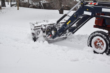 Tractor clearing snow