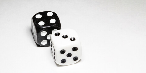 two white and black dices on a white background Win or lose Catch your luck Gambling equipment