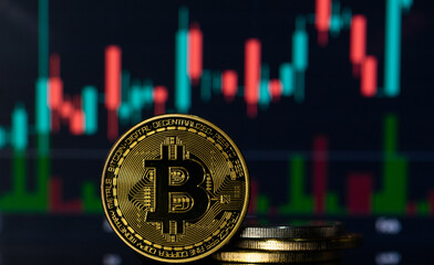 Bitcoin with a blurred background financial charts 