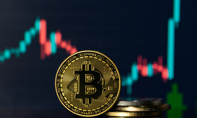 Bitcoin with a blurred background financial charts 