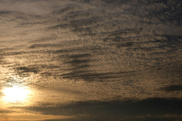 Fototapeta na wymiar Sunset with cloudy sky background, beautiful sky image at summer sunset.